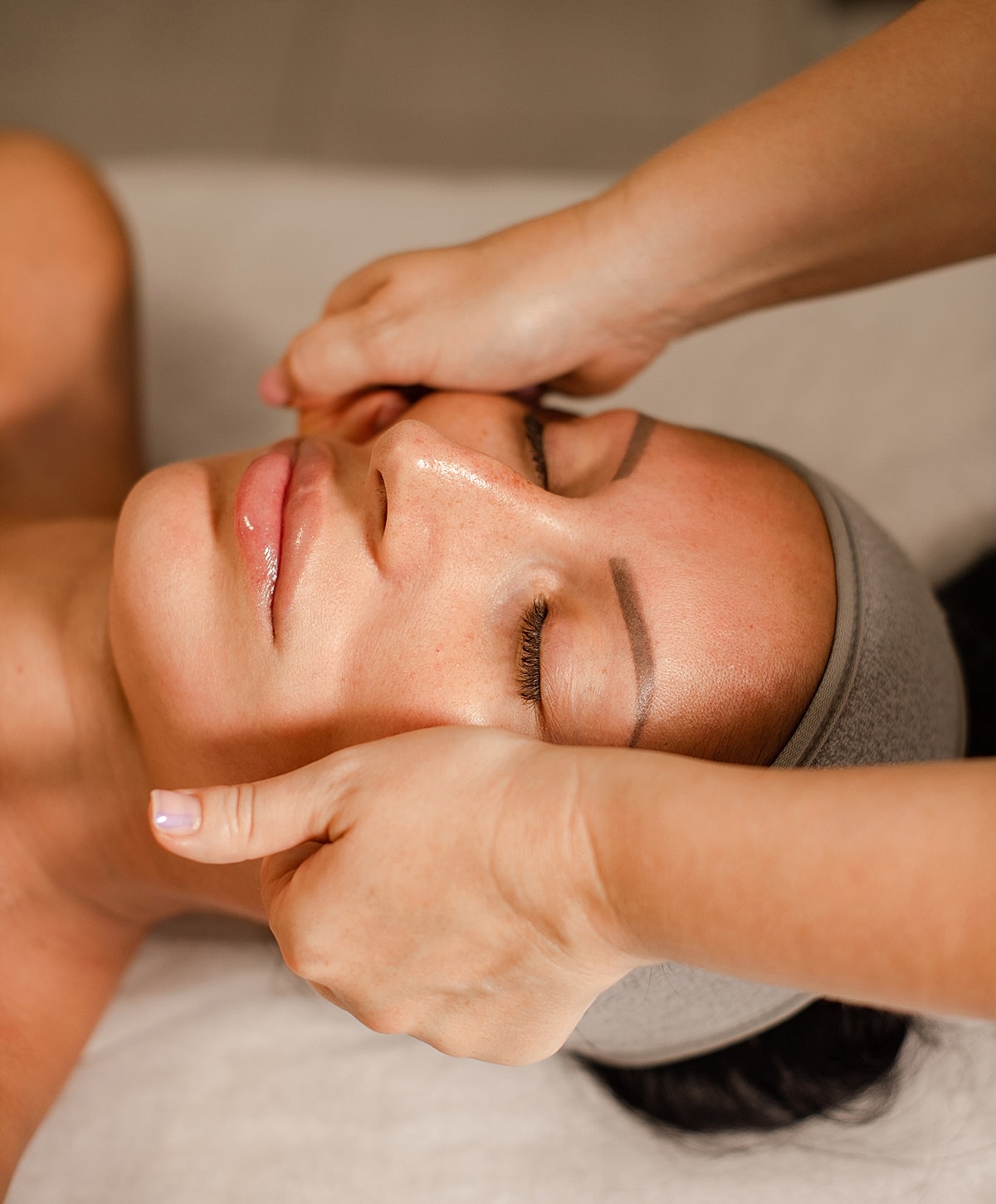 Facial massage relaxation therapy session.