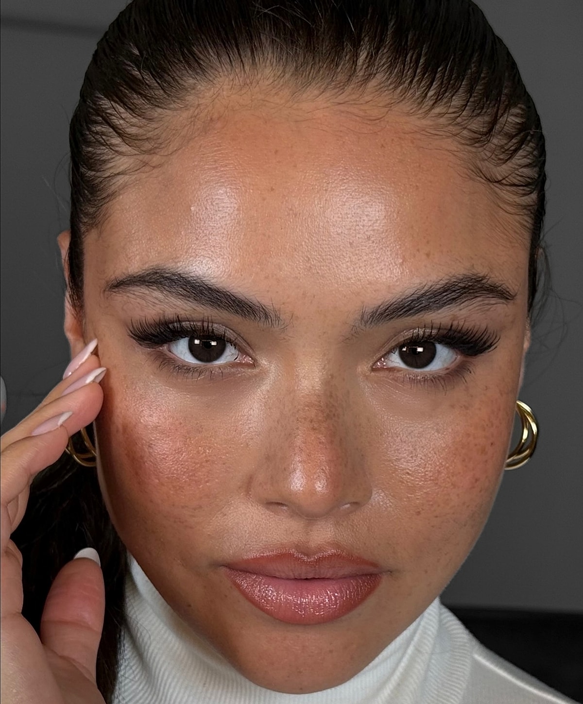 Close-up of a woman with flawless skin.