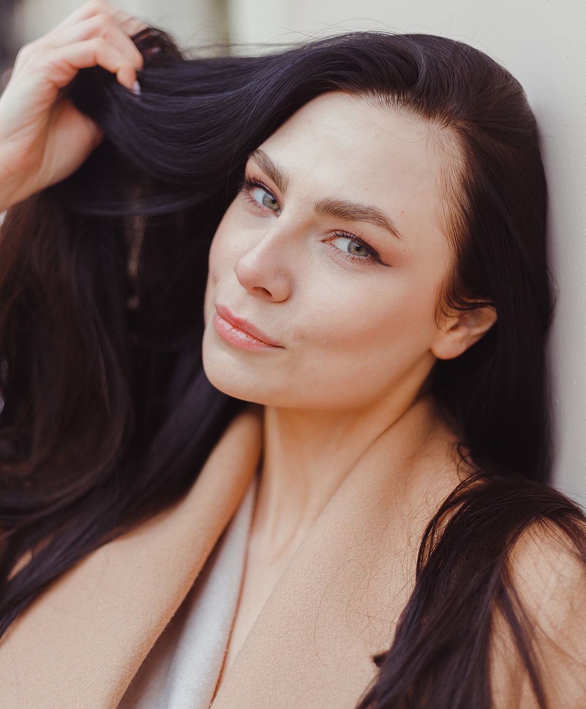 Woman with long hair posing gracefully.