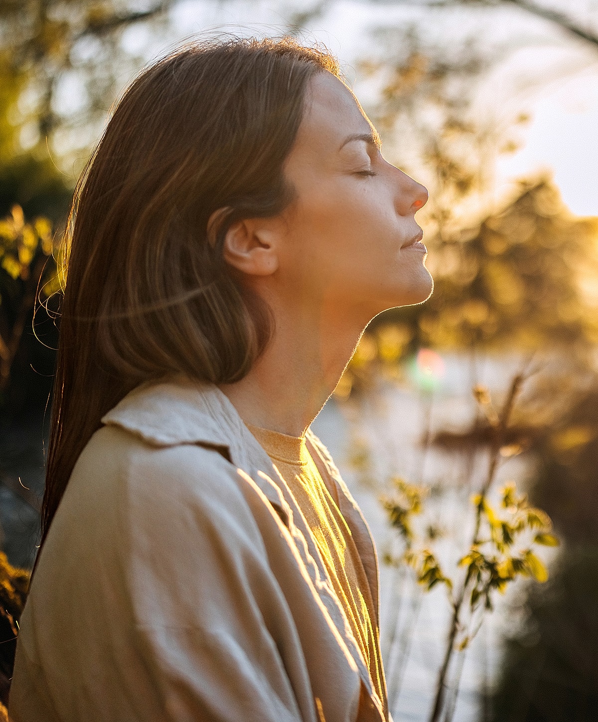 Woman enjoying nature during sunset.