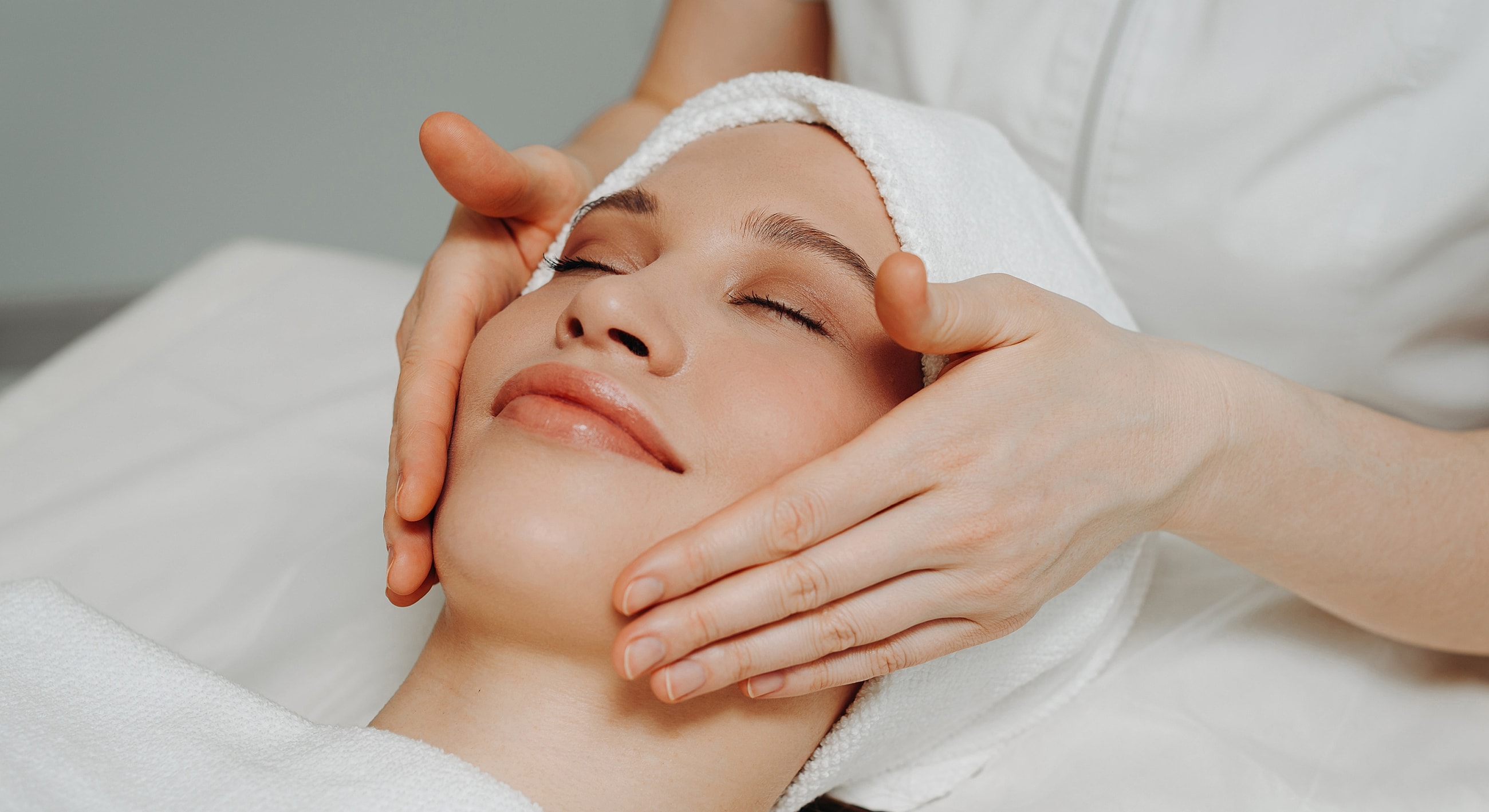 Facial massage at a spa or wellness center.